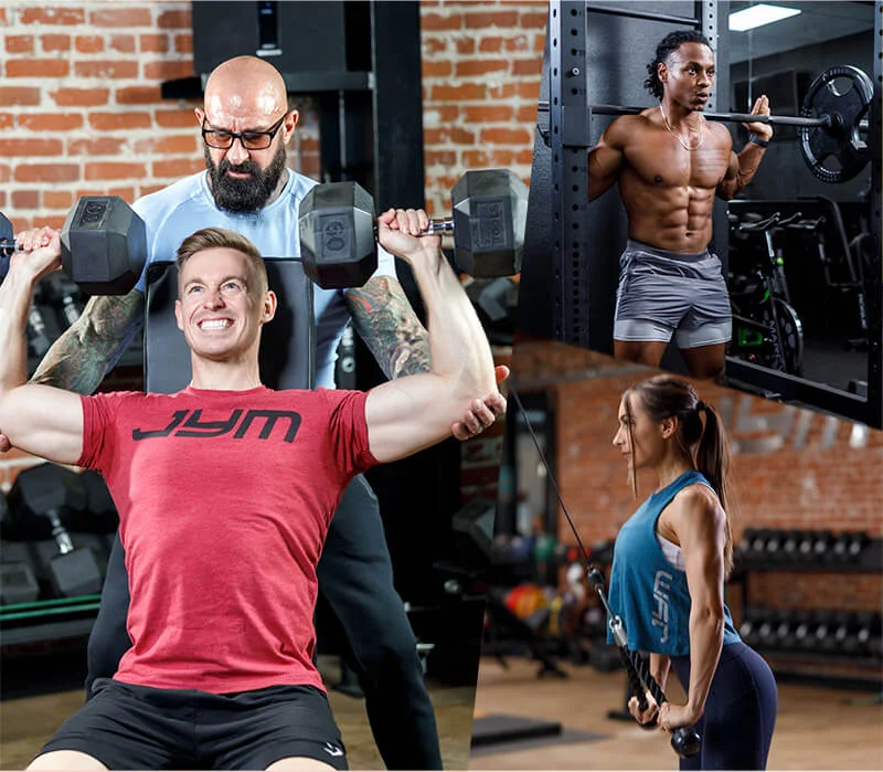 A gym scene with four individuals working out. One person, assisted by a bearded trainer, is doing shoulder presses with dumbbells. Another person is performing a squat with a barbell. The third person, following Dr. Jim Stoppani's personalized training program, is using a cable machine for tricep exercises.